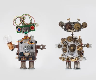 futuristic-robots-on-gray-background-friendly-mechanical-toys-with-picture-id655105682